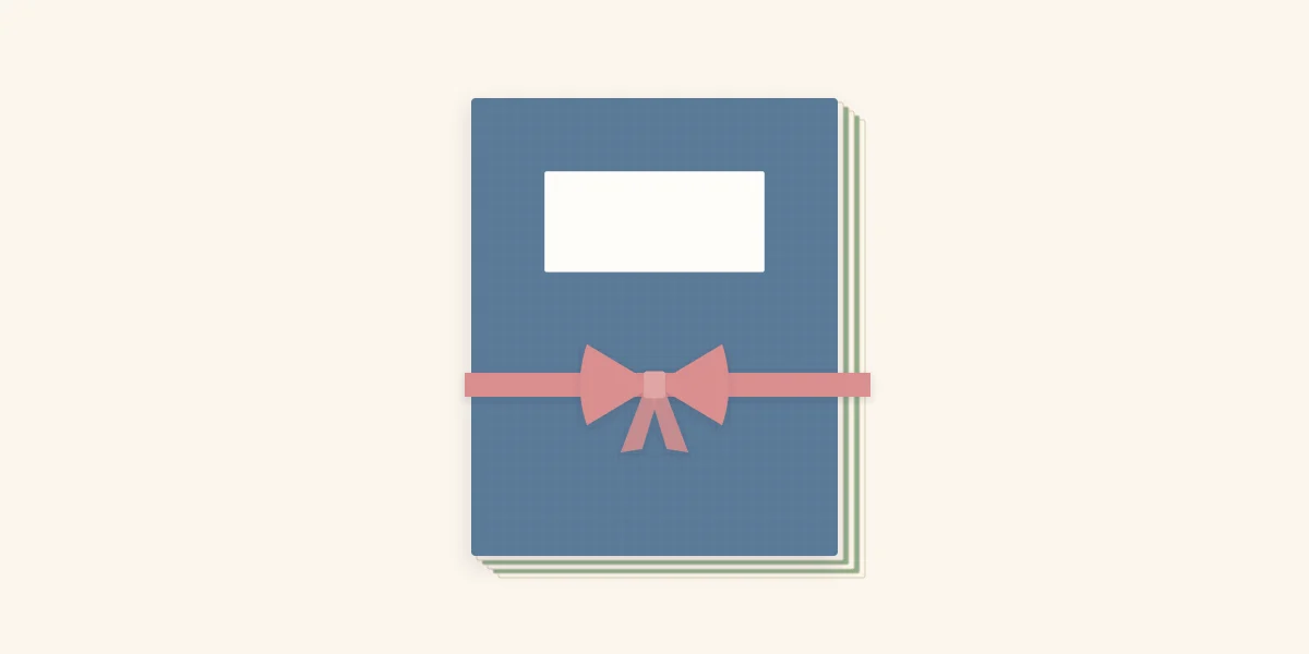 A closed accordion mini album with stiff covers tied shut with a ribbon bow