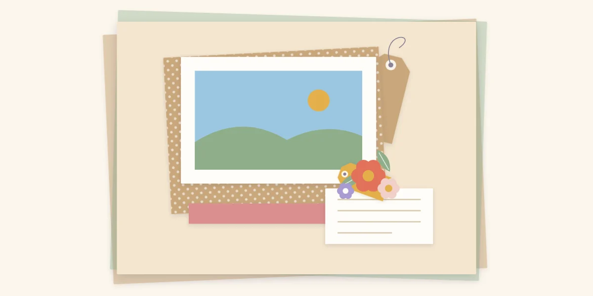 A tag tucked halfway behind a matted photo and a second tag under a cluster of paper flowers