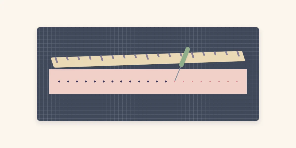 A paper strip on a foam mat with evenly spaced pierced holes along a ruler and a piercing tool